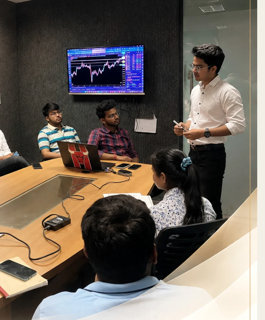 Real trading mentorship session with a mentor teaching students around a conference table